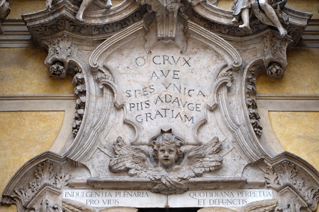 Angels and epigraph: Hail, the only hope, add more grace to the pious, facade of Santa Maria Maddalena Church in Rome, Italyの写真素材