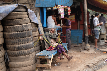 A homeless person on the streets of Topsia, people who can only sustain themselves through begging. Kolkata, India on February 10, 2016.のeditorial素材