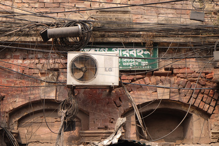 The chaos of cables and wires in Kolkata. Uncovered optical fiber technology open air outdoors in Asian cities.のeditorial素材