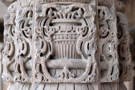 Columns with stone carving in courtyard of Quwwat-Ul-Islam mosque, Qutab Minar complex, Delhi, India