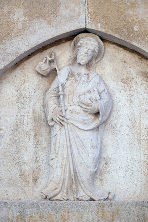 Jesus the Good Shepherd relief on the St. Marks Cathedral in the historic city Korcula at the island Korcula in Croatiaの写真素材