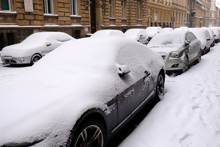 Snow covered car parked in streets of Zagreb, Croatiaの写真素材
