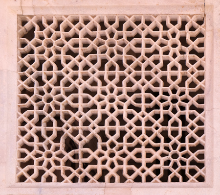 Beautiful stone carvings on the wall in Fatehpur Sikri complex, Uttar Pradesh, India