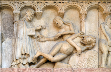Plate with stories from Genesis: Creation Of Eve relief by Wiligelmo, Modena Cathedral, Italyの写真素材
