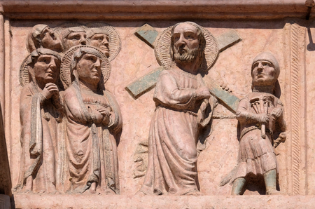 Path towards the Calvary, relief on Facade of Saint Anastasia Church in Verona, Italyの写真素材