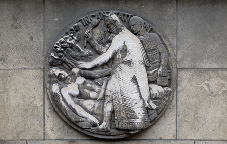 Incantation. Stone relief at the building of the Faculte de Medicine Paris, Franceのeditorial素材