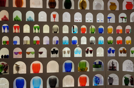 Imaginative display of bright colourful glasswork in a craft and design shop in Florence, Tuscany, Italyのeditorial素材