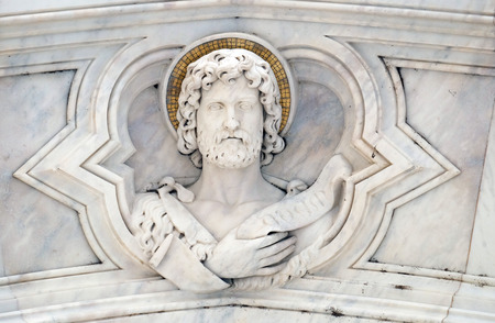 Saint John the Baptist, relief on the facade of Basilica of Santa Croce (Basilica of the Holy Cross) - famous Franciscan church in Florence, Italyのeditorial素材