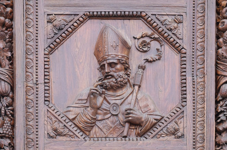 Saint, wooden door of the Basilica of Santa Croce (Basilica of the Holy Cross) in Florence, Italyのeditorial素材