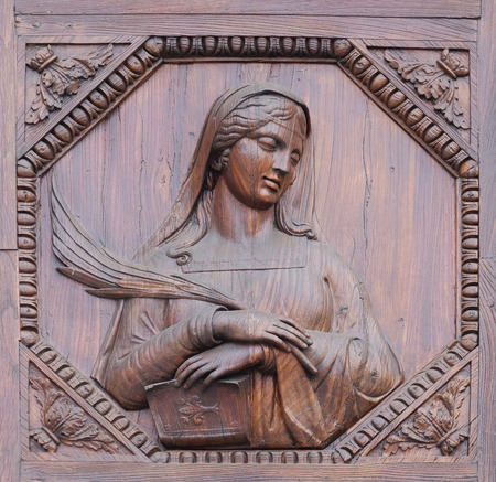 Saint, wooden door of the Basilica of Santa Croce (Basilica of the Holy Cross) in Florence, Italyのeditorial素材
