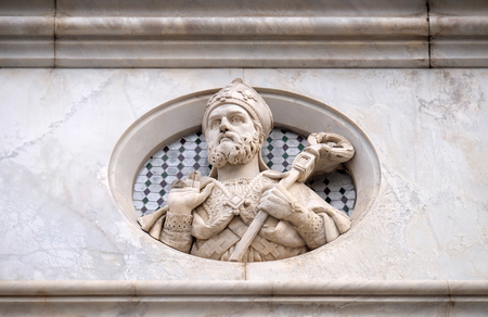 Saint, relief on the facade of Basilica of Santa Croce (Basilica of the Holy Cross) - famous Franciscan church in Florence, Italyのeditorial素材