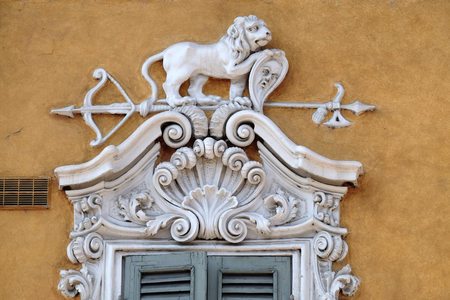 Beautiful house facade with carved stone animals in Mantua, Italyの写真素材
