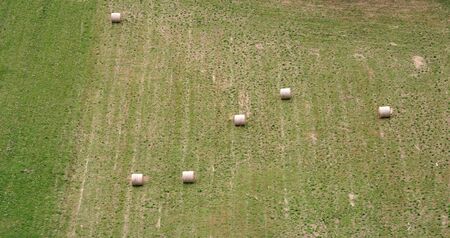 Aerial view Haystacks on the harvest fields in summertime, Zdencina, Croatiaの写真素材