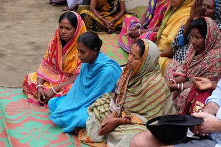 Women at an outdoor Mass in Mitrapur village, West Bengal, India