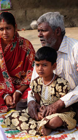 Faithful Catholics during an outdoor Mass in the village of Mitrapur, West Bengal, India