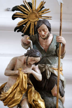 Baptism of the Lord, baptismal font in the Saint Martin church in Unteressendorf, Germany