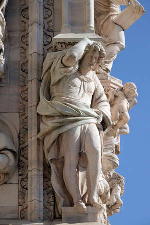 Atlantes supporting the main facade of the Milan Cathedral, Duomo di Santa Maria Nascente, Milan, Lombardy, Italyのeditorial素材