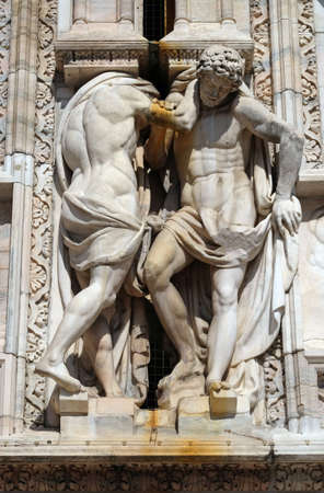 Atlantes supporting the main facade of the Milan Cathedral, Duomo di Santa Maria Nascente, Milan, Lombardy, Italyのeditorial素材