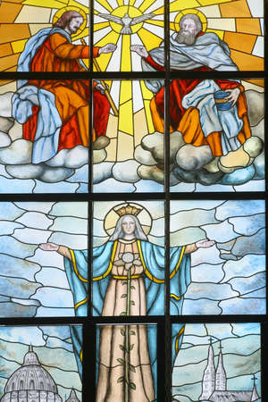 Coronation of the Virgin Mary, stained glass window in the church of St. Anthony of Padua and Virgin Mary Queen of the Martyrs in Lasinja, Croatiaのeditorial素材