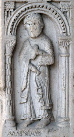 Saint Matthias the apostle, bass relief by followers of Wiligelmo, Princesâ Gate, Modena Cathedral, Italyのeditorial素材