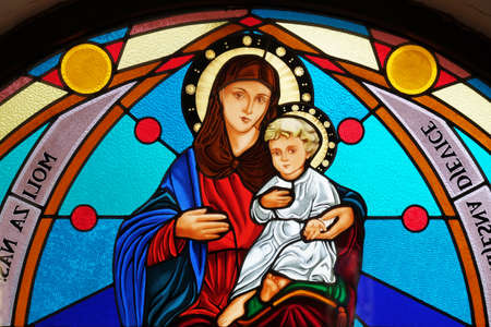 Virgin Mary with baby Jesus, stained glass window in the Shrine of the Our Lady Queen of Peace in Hrasno, Bosnia and Herzegovinaのeditorial素材
