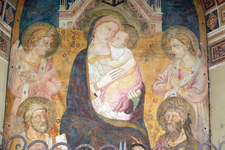 Virgin Mary with baby Jesus, fresco on the house facade in Florence, Italyのeditorial素材