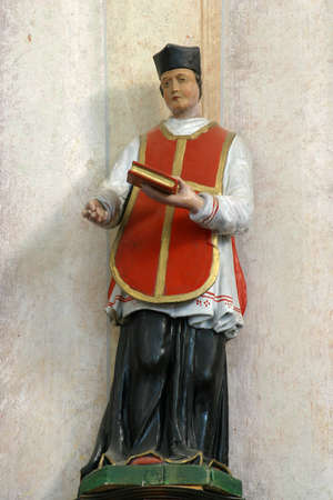 Saint Isidore statue on the main altar at Saint Anne Church in Rozga, Croatia
