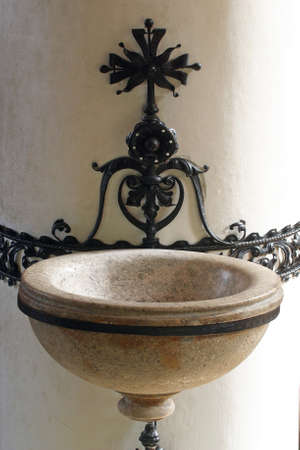 Holy water font in church of Saint Catherine of Alexandria in Zagreb, Croatia