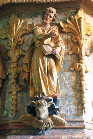 St. Luke the Evangelist statue at the pulpit in the Church of the Assumption of the Virgin Mary in Taborsko, Croatiaのeditorial素材