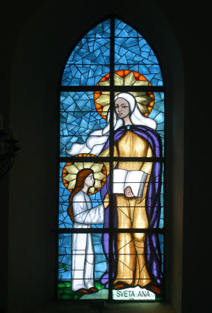 Saint Anne, Education of the Virgin Mary, stained glass window at Our Lady of Miracles Parish Church in Ostarije, Croatiaのeditorial素材
