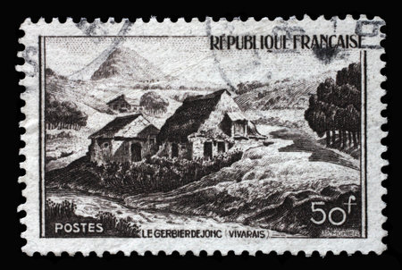 Stamp printed in the France shows image of Mont Gerbier de Jonc in the rural landscape of the Vivarais region in the south-east of France, Tourism series, circa 1949.の写真素材