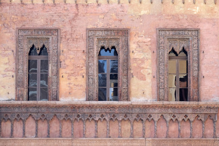 Old window in palace on Piazza Sordello The historic city center of  Mantua, Italyの写真素材