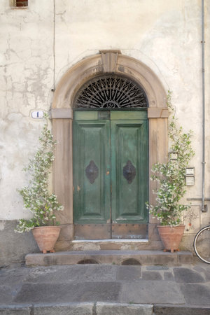 Residential doorway detail from the medieval town Lucca, Tuscany, Italyの写真素材