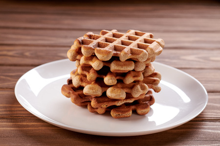 Homemade Viennese waffles on wooden backgroundの写真素材