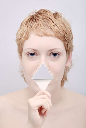 Portrait of the young woman with tongue from paperの写真素材