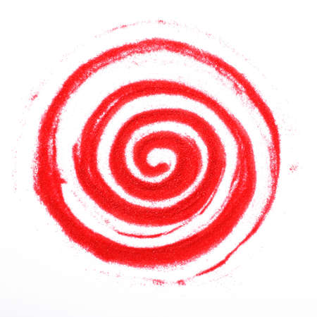 Red sandy spiral on a white backgroundの写真素材