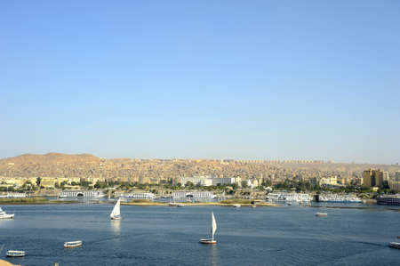 Boat sailing down the river at summer dayの写真素材