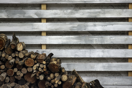 Pile of firewood. Preparation of firewood for the winter. Background.