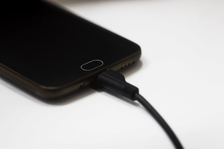 USB cable for smartphone on white background.の写真素材