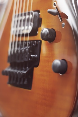 Electric guitar close-up with soft focus of brown color, Floyd Roseの写真素材