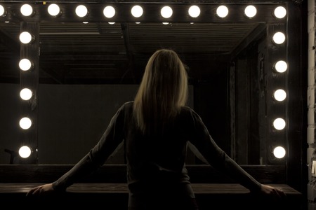 silhouette woman and big mirror. fashion trendy style.party fashion concept. Copy space.の写真素材