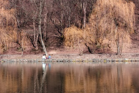 Foggy spring landscape at sunrise of Whitford Lake with reflections in calm water,の写真素材