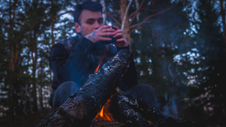 The guy at the campfireの写真素材