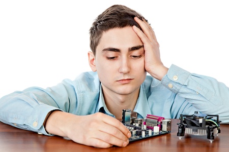 Young computer engineer, on white background.	Small DOF