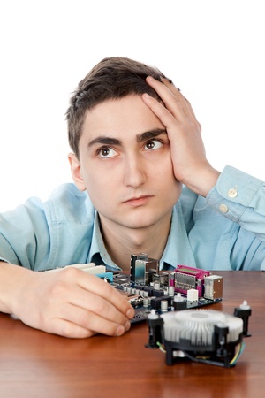 Young computer engineer, on white background.	Small DOFの写真素材