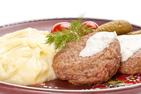 Meat rissoles with  mashed  potato.  White background.の写真素材