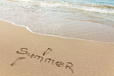 Summer written in a sandy tropical beachの写真素材