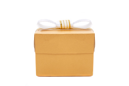 Beautiful gold present box with white bow. Isolated on white backgound.