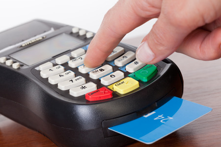 Close-up of cards servicing with POS-terminalの写真素材