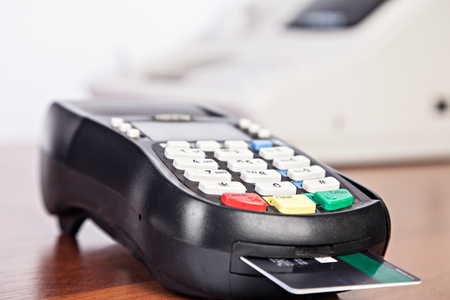 Close-up of cards servicing with POS-terminalの写真素材